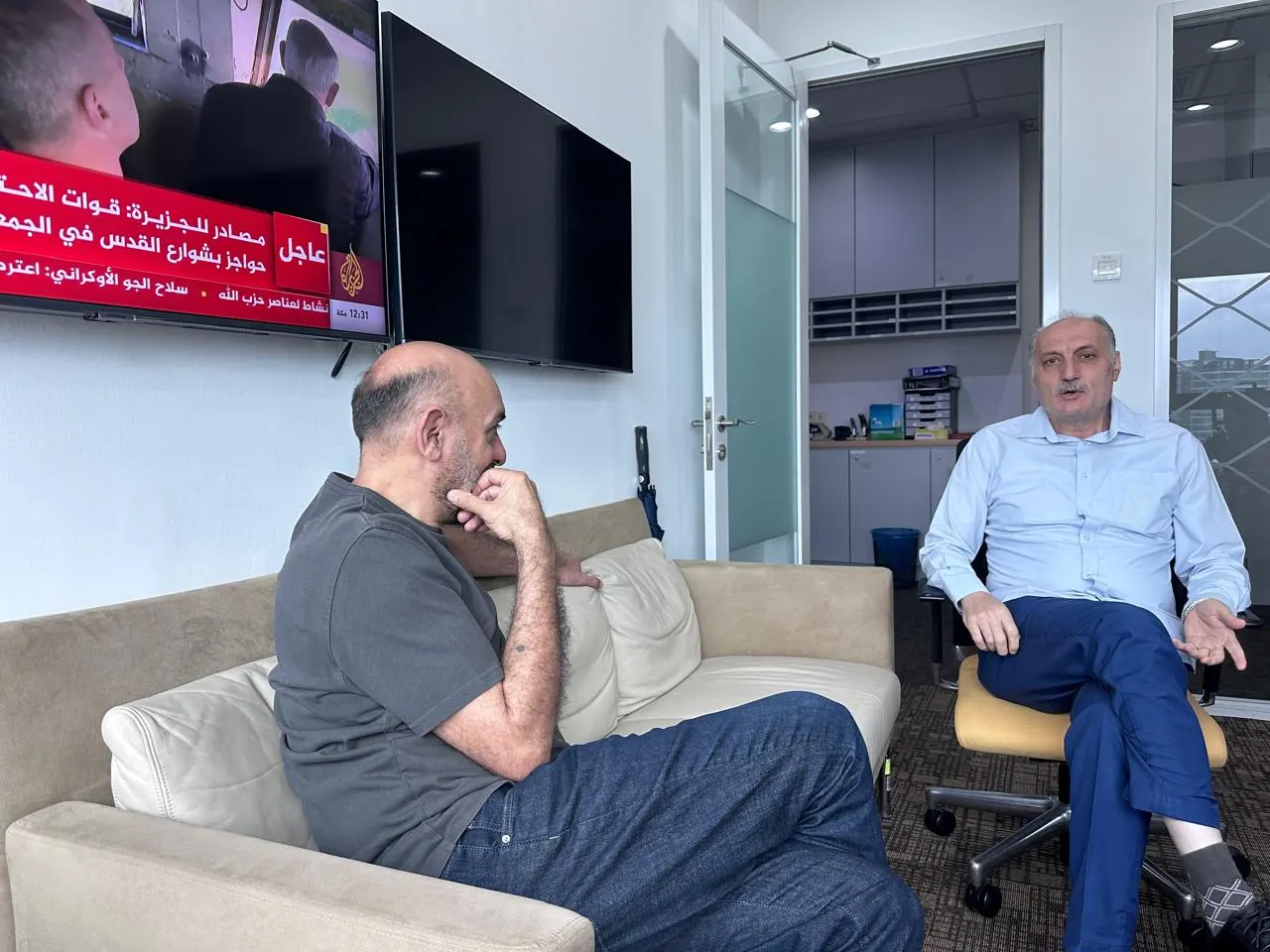 A conversation in the Al Jazeera Kuala Lumpur office
