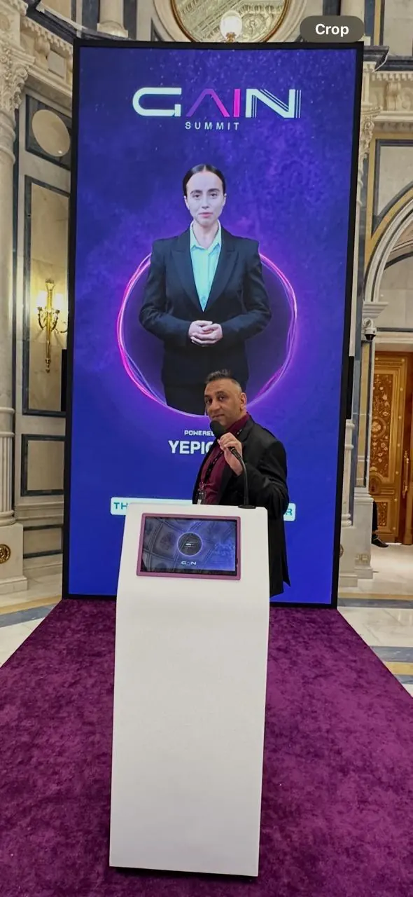 An AI avatar on screen at the GAIN Summit