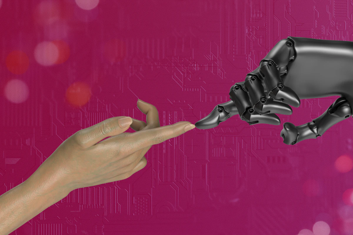 A human hand reaching toward a robotic hand